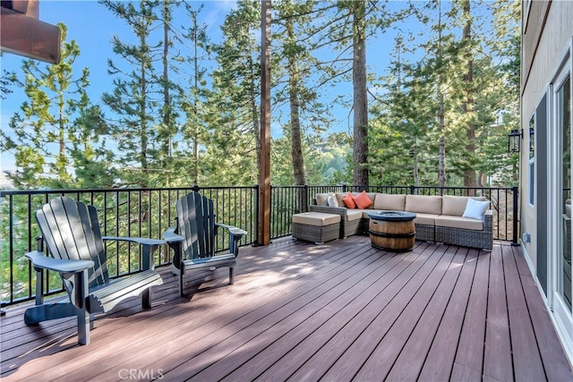 wooden deck featuring an outdoor hangout area