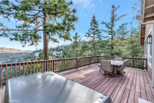 wooden deck with a mountain view