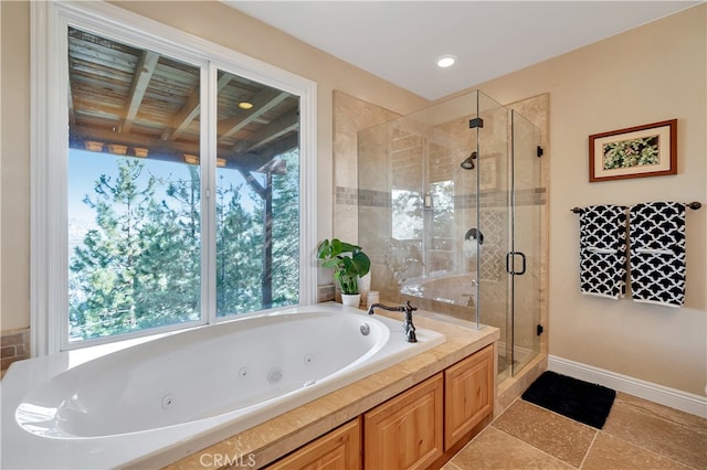 bathroom featuring plus walk in shower and tile patterned floors