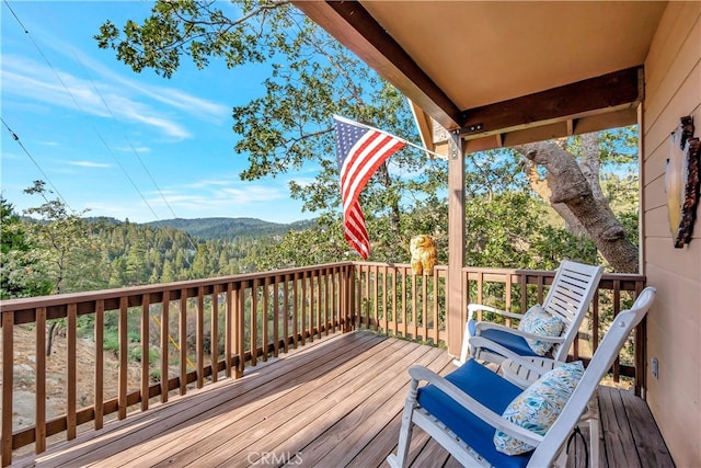 wooden terrace featuring a mountain view