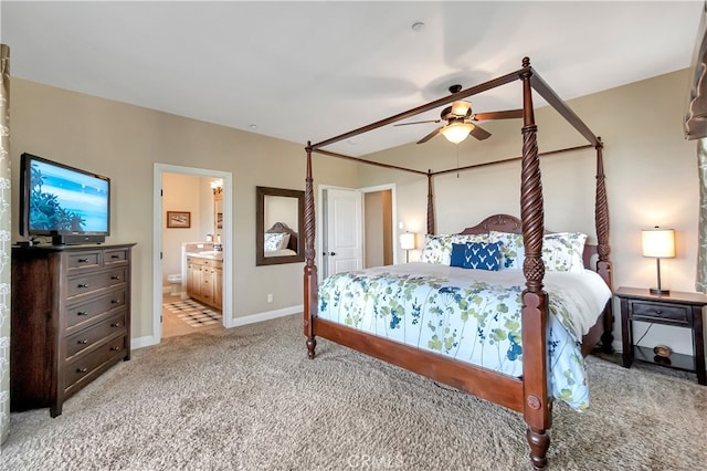 carpeted bedroom with ceiling fan and connected bathroom