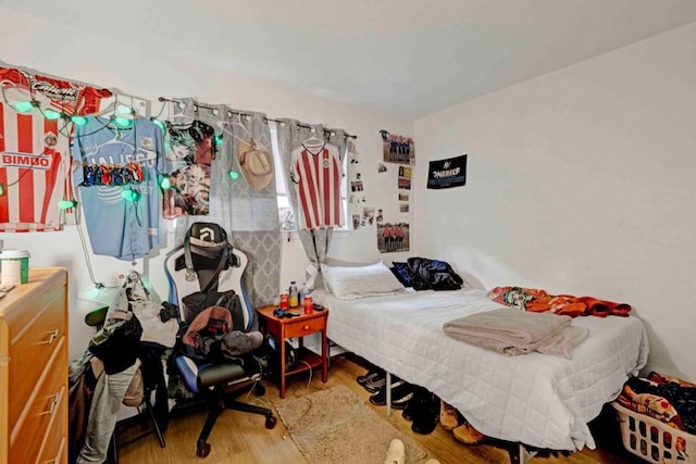 bedroom featuring wood-type flooring