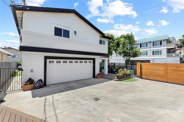 exterior space with a garage and a balcony