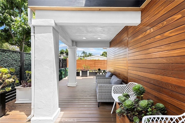 wooden deck with outdoor lounge area