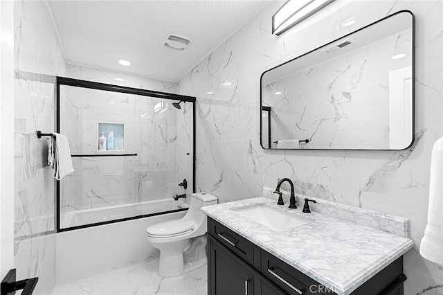 full bathroom with combined bath / shower with glass door, toilet, tile walls, vanity, and a textured ceiling