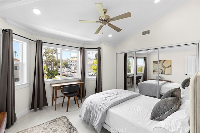 bedroom with ornamental molding, vaulted ceiling, multiple windows, and ceiling fan