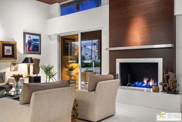 living room featuring a towering ceiling