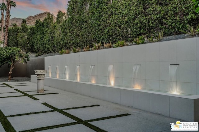 patio terrace at dusk with a mountain view