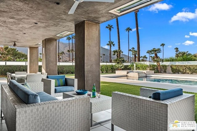 view of patio featuring an outdoor living space, ceiling fan, and a fenced in pool