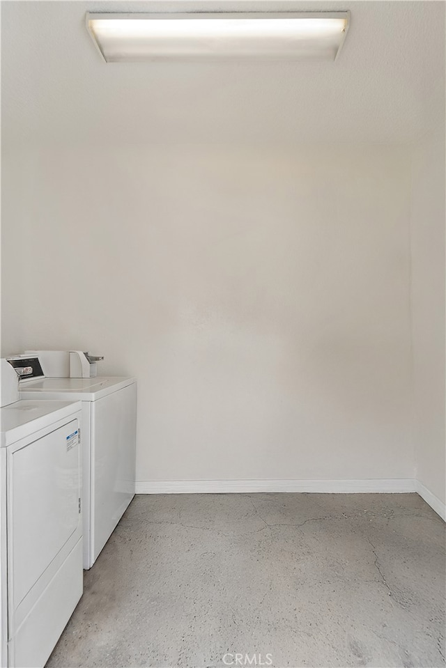 clothes washing area featuring washer and dryer