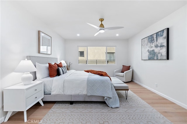 bedroom featuring ceiling fan and light hardwood / wood-style flooring