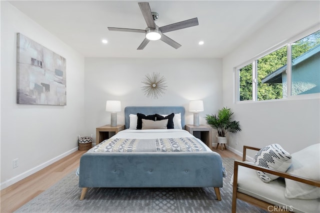 bedroom with hardwood / wood-style flooring and ceiling fan