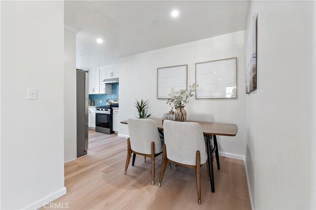 dining area featuring light wood-type flooring