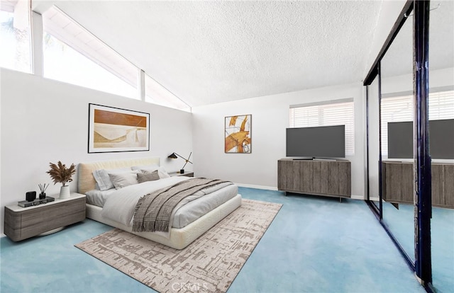 carpeted bedroom with baseboards, a textured ceiling, and vaulted ceiling