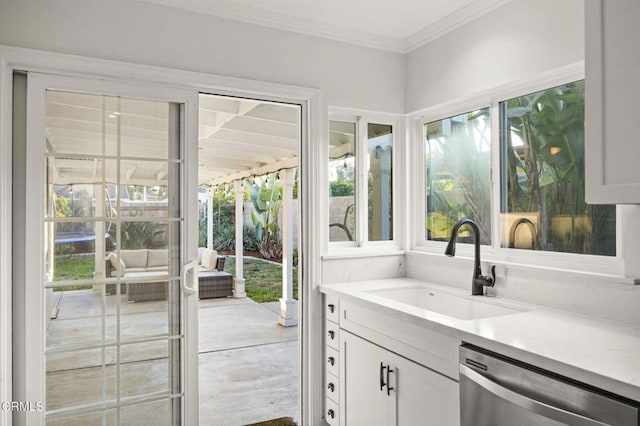 interior space with plenty of natural light, crown molding, and vanity