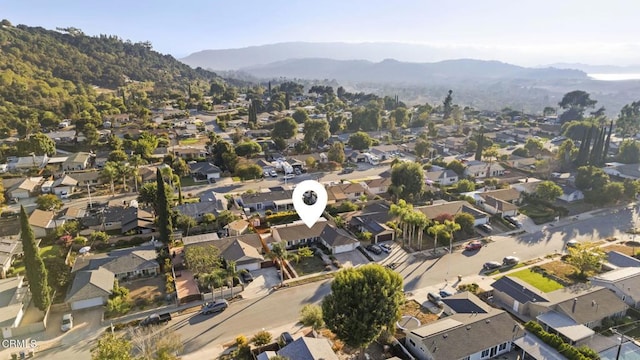 birds eye view of property featuring a mountain view