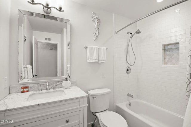 full bathroom featuring vanity, shower / bath combo, and toilet