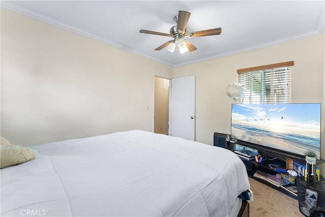 bedroom with ceiling fan, crown molding, and carpet