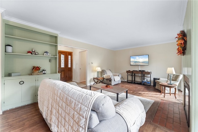 living room featuring crown molding and dark hardwood / wood-style floors