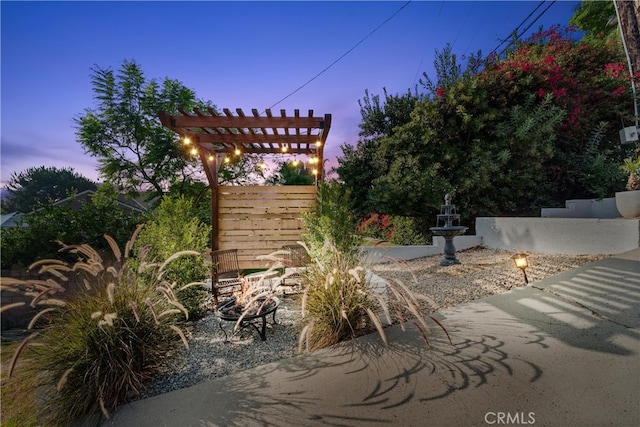 view of patio terrace at dusk