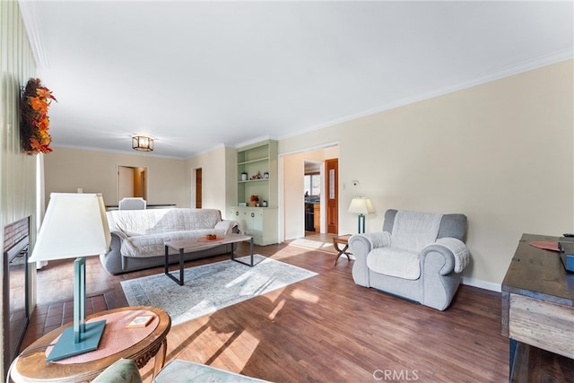 living room with crown molding and hardwood / wood-style floors