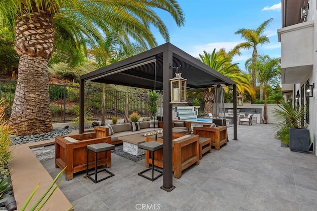 view of patio featuring a gazebo and an outdoor living space with a fire pit