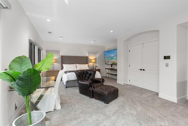 carpeted bedroom with a closet