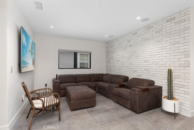 living room featuring brick wall