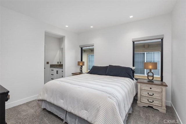 carpeted bedroom with ensuite bath