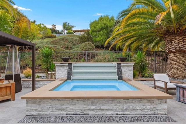 view of pool with an in ground hot tub