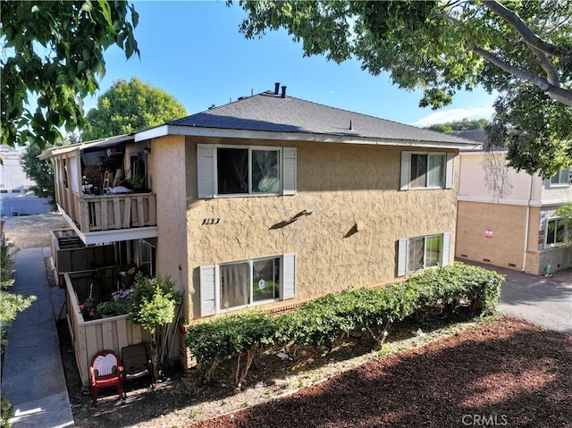 view of property exterior featuring a balcony