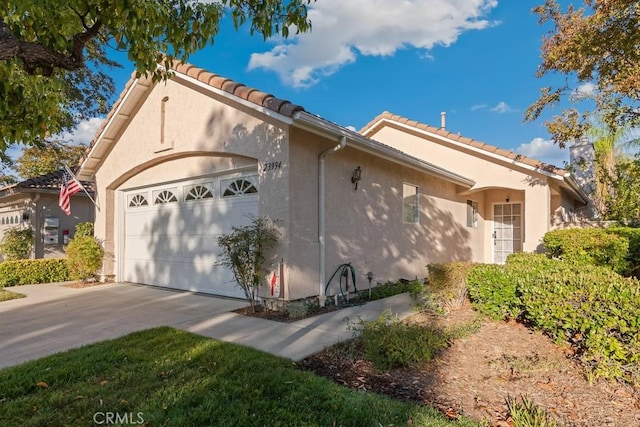 view of side of property with a garage