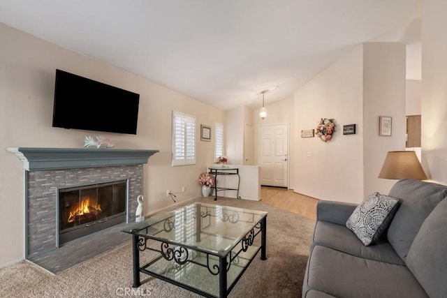 living room featuring light hardwood / wood-style floors and lofted ceiling