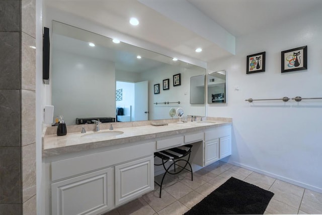 bathroom featuring tile patterned flooring and vanity