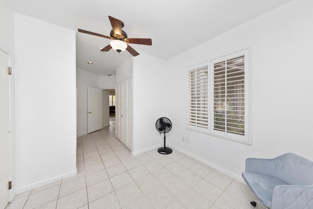 unfurnished room featuring light tile patterned flooring and ceiling fan