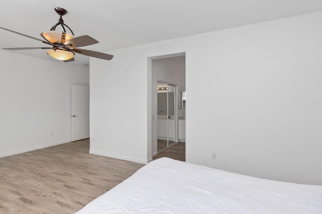 bedroom featuring ceiling fan, a closet, and light hardwood / wood-style floors