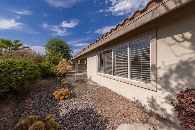 view of property exterior featuring a patio