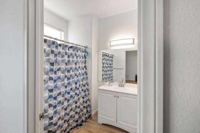 bathroom with vanity, hardwood / wood-style floors, and a shower with shower curtain