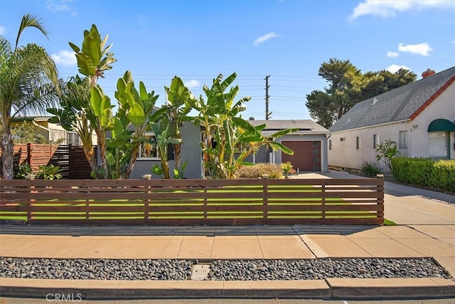 obstructed view of property featuring a garage