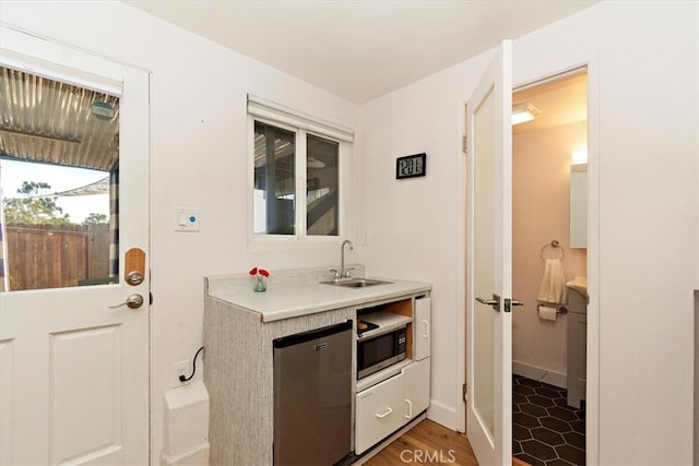 bathroom with hardwood / wood-style floors and sink