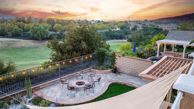 patio terrace at dusk with a gazebo and a fire pit