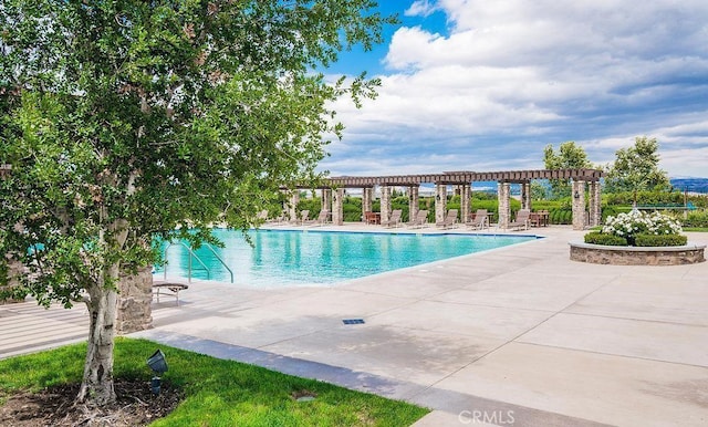 view of swimming pool with a pergola and a patio area