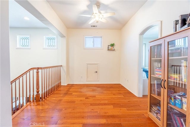 interior space with light wood-type flooring and ceiling fan