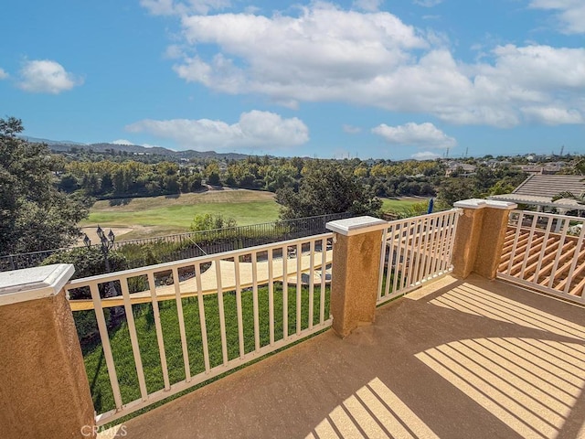 wooden deck featuring a lawn