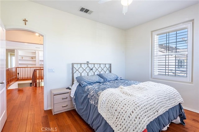 bedroom with hardwood / wood-style flooring and ceiling fan