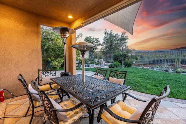 patio terrace at dusk with a yard