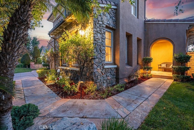 view of property exterior at dusk