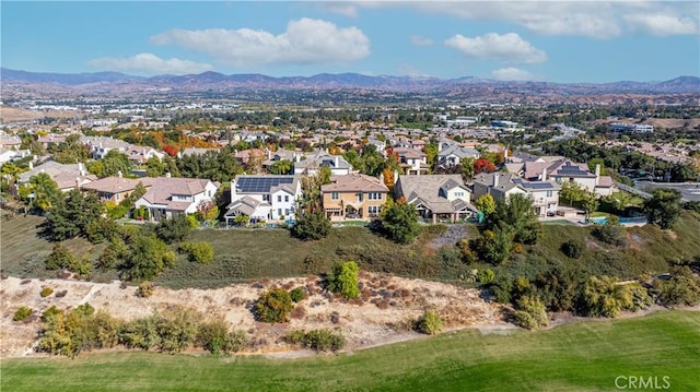 birds eye view of property featuring a mountain view