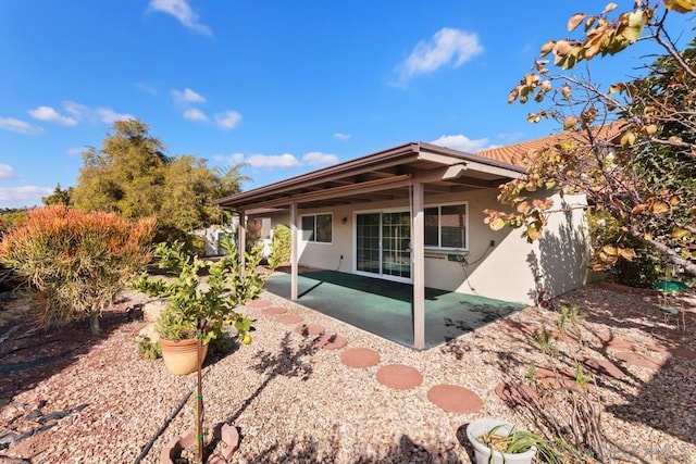 rear view of house featuring a patio