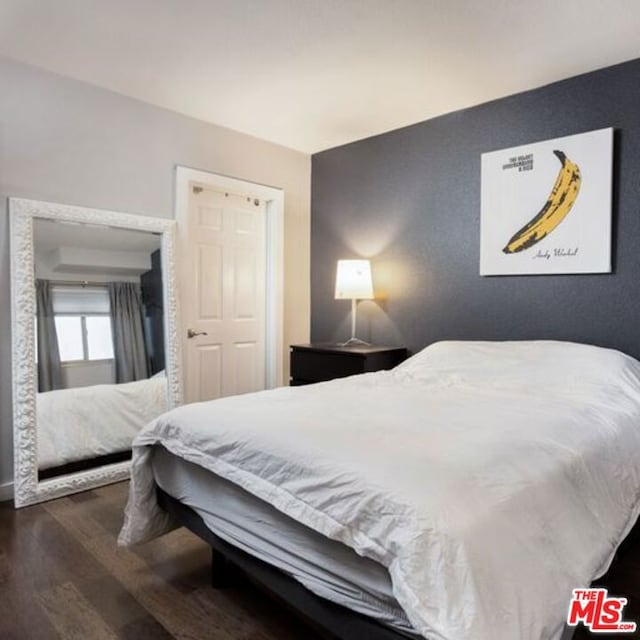 bedroom featuring dark wood-type flooring